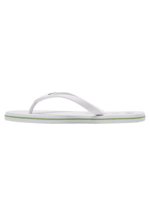 White flip-flop featuring a textured strap, green trim, and flat sole. Minimalist design with a flexible rubber material for comfort.