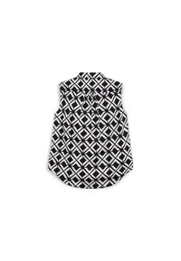 Top senza maniche bianco e nero con un motivo geometrico, dotato di colletto e dettaglio plissettato sul retro.