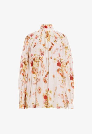 Blusa floral en tejido suave y ligero. Presenta un cuello alto, mangas largas y un corte holgado con numerosos patrones florales coloridos.