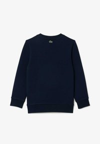 Sweatshirt bleu marine en tissu doux, avec un col rond, des manches longues, des poignets côtelés et un petit logo vert au dos.