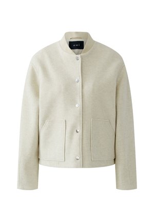 Wolljacke in Cremefarben mit geripptem Kragen, Front mit Druckknöpfen und zwei großen Fronttaschen.