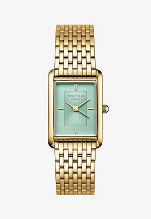 Orologio rettangolare dorato con un quadrante verde menta testurizzato, indicatori delle ore sollevati e un bracciale in maglia dorata. Finiture metalliche lisce sui lati.