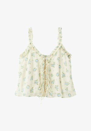 Camisole florale crème avec fleurs bleues, bordures à volants, bretelles fines et détail à lacets sur le devant avec longs liens.