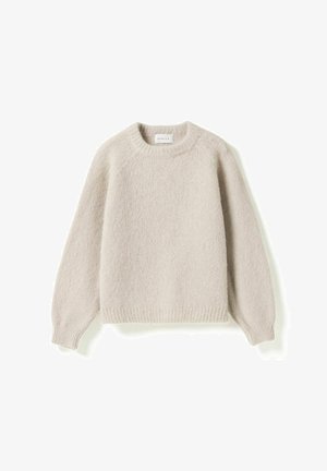 Pull beige clair en maille douce avec col rond, manches longues et bord-côtes aux poignets et à l’ourlet, présenté à plat sur fond blanc.