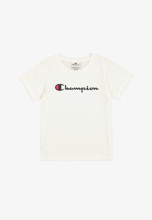 Camiseta de algodón blanca con un logo negro de "Champion" con acentos rojos. Manga corta y escote redondo clásico.
