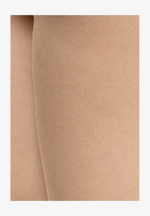 Huidskleurige panty met een gladde, matte textuur, met een naadloos ontwerp en een lichte glans, ontworpen voor comfort en pasvorm.