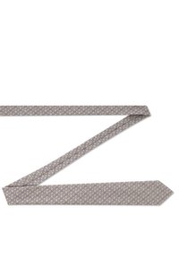 Krawat w jasnym beżu z okrągłymi niebieskimi i granatowymi wzorami. Wykonany z gładkiego materiału, ma spiczasty koniec i klasyczny design.