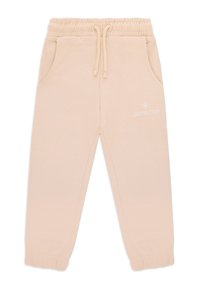 Pantaloni della tuta beige con vita a coulisse, tasche laterali e polsini elastici. Presentano un piccolo logo bianco sul lato sinistro. Tessuto morbido.