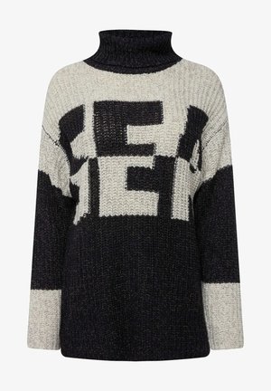 Maglione oversize lavorato a maglia con collo alto, colori nero e crema, e lettere in grassetto. Tessuto testurizzato con una vestibilità morbida.