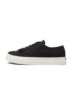 Black canvas sneakers with a round toe, flat white rubber sole, and six eyelets for laces. Features a small logo tab on the heel.