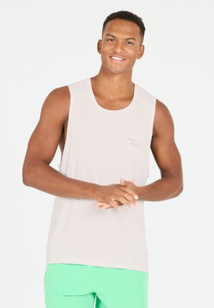 Light beige sleeveless tank top with a round neckline and subtle green accent detailing. The fabric appears smooth and lightweight.