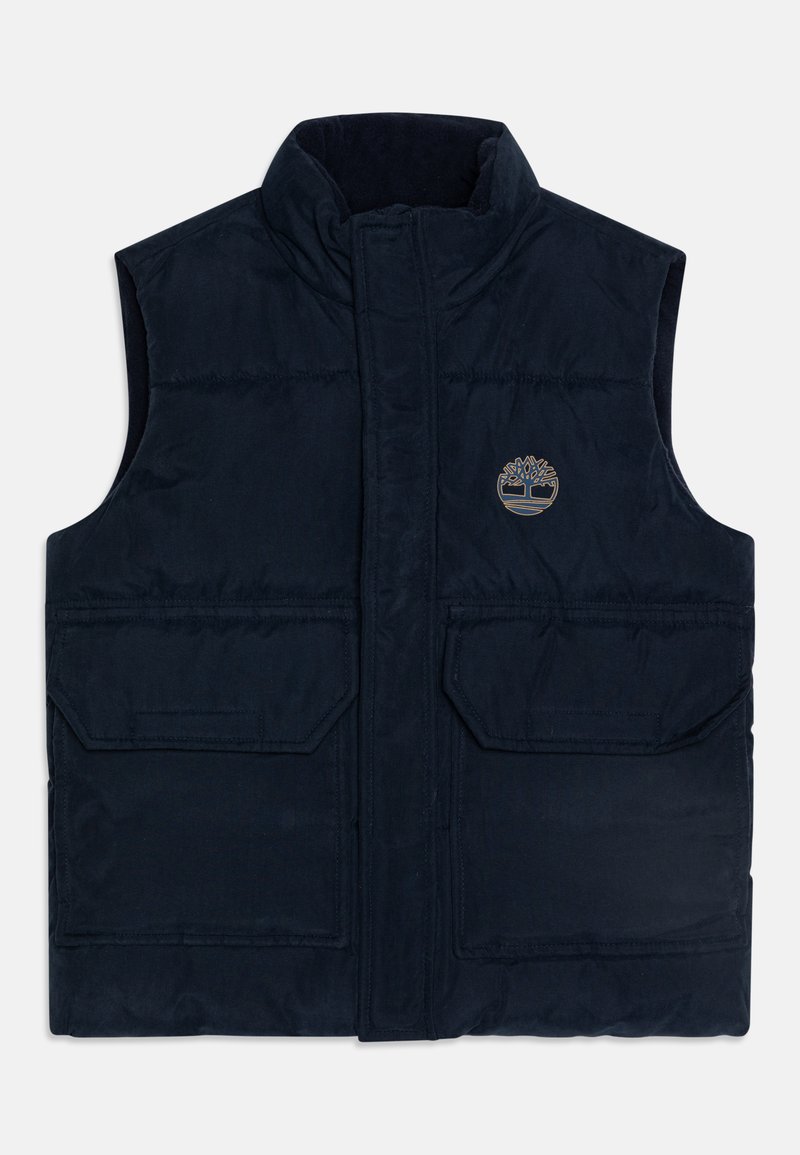 Gilet senza maniche di colore blu navy, imbottito, con colletto alto, due tasche con patta sul davanti e piccolo logo dell'albero sul lato sinistro del petto.