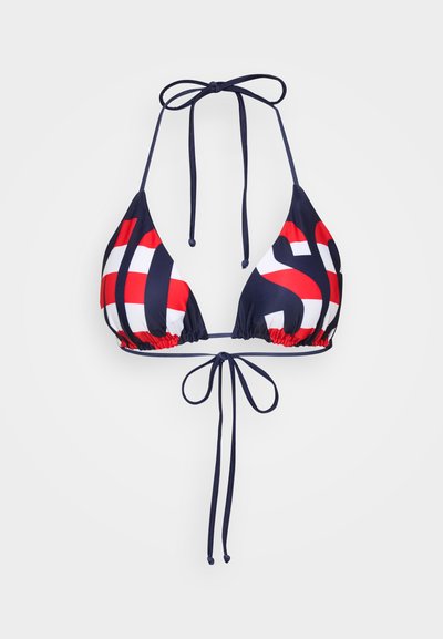 Tamsiai mėlynas bikini viršus su trikampėmis taurėmis, turintis raudonai baltą geometrinį raštą. Susiriša kaklo ir nugaros gale su reguliuojamomis virvutėmis.