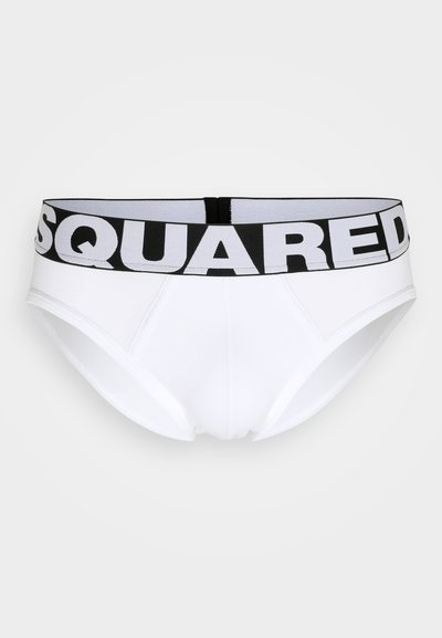 Culottes en coton blanc avec une taille noire arborant "SQUARED" en lettres blanches en gras. Le design comprend une forme de culotte classique et une texture lisse.