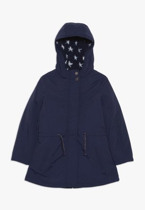 Parka bleu marine à capuche avec fermeture éclair à l'avant, taille à cordon de serrage, deux poches latérales et doublure polaire avec motif d'étoiles blanches à l'intérieur de la capuche.