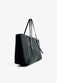 Black tote bag made of synthetic material, featuring a smooth texture, dual handles, zippered pocket, and silver-tone hardware accents.