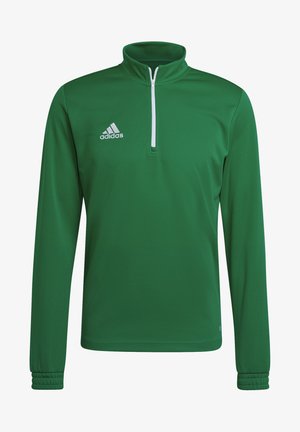Pullover verde a maniche lunghe con colletto alto, zip frontale e polsini elasticizzati. Presenta il logo bianco di Adidas sul petto sinistro. Tessuto con texture liscia.