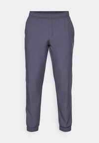 Grijze sportbroek met een elastische tailleband, tapse pijpen en cuffed hems. Glad textuur en minimale branding aan de zijkant.
