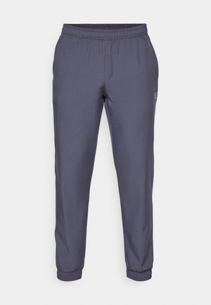 Pantaloni sportivi grigi con vita elasticizzata, gambe affusolate e orli aderenti. Texture liscia e branding minimale di lato.