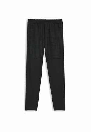 Pantaloni sportivi neri con un pannello testurizzato che presenta un motivo a griglia nella parte superiore. Progettati con una vita elastica e tasche con zip.