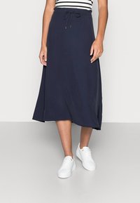 Navy midi skirt made of soft fabric, featuring an elastic waistband with a drawstring detail, and a relaxed, flowing silhouette.