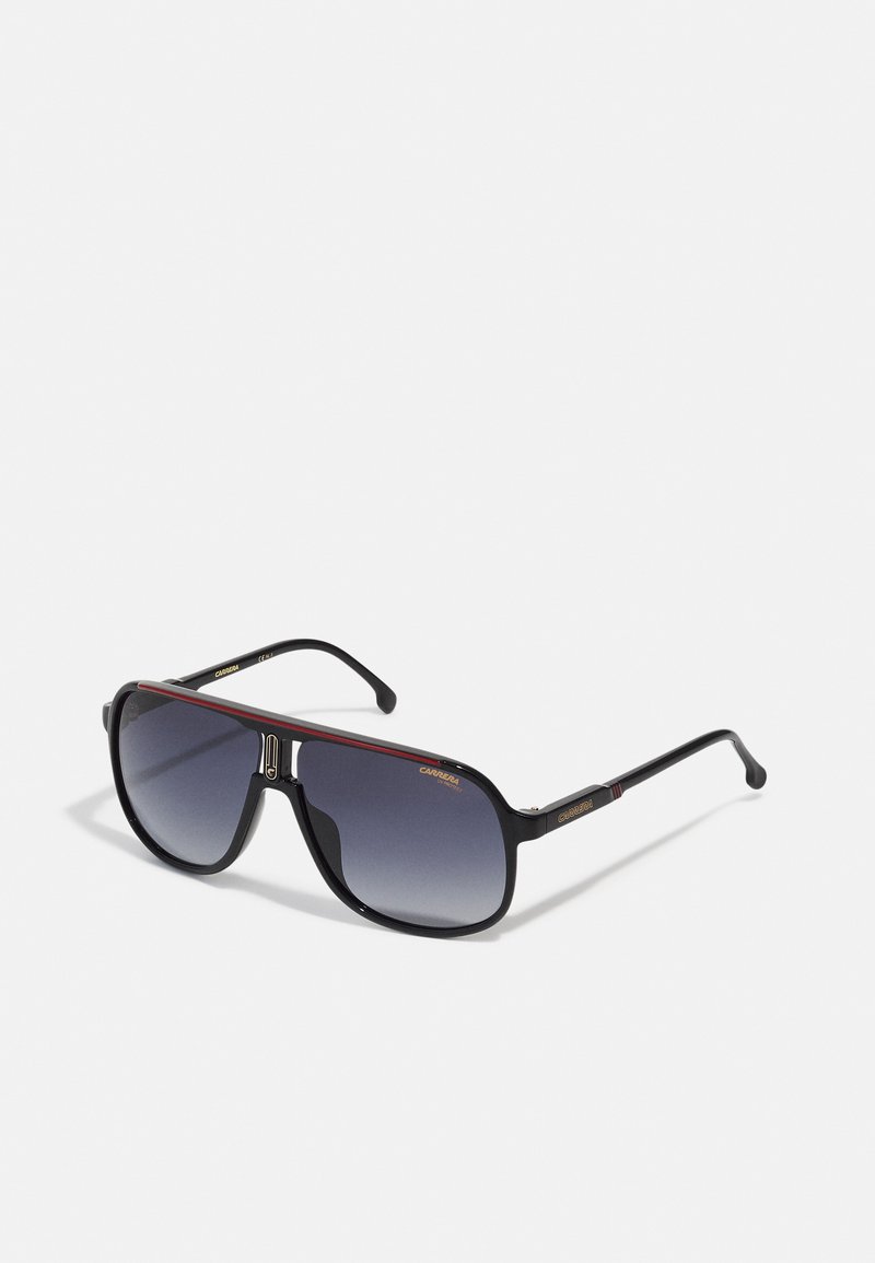 Black oversized sunglasses with gradient lenses, rectangular frame, red accent stripe, metallic detailing on the bridge, and sturdy temples.