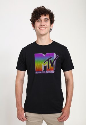 Black cotton t-shirt featuring a colorful MTV logo in gradient shades of purple and rainbow, with "MUSIC TELEVISION" text below.