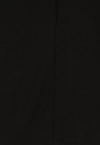 Black fabric showing a smooth texture, with visible seams and stitching. The design is simple and unadorned, primarily solid in color.