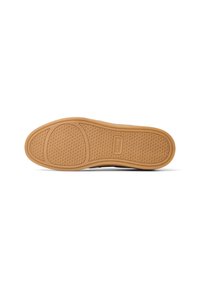 Sole di scarpa in gomma con un motivo testurizzato, caratterizzata da un colore beige chiaro e da un design flessibile. La suola presenta un logo al centro.
