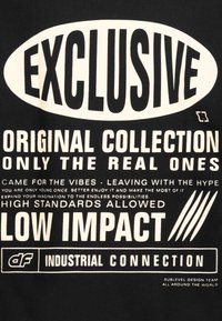Black t-shirt featuring bold, white text with phrases like "EXCLUSIVE" and "LOW IMPACT." Includes a graphic design with various fonts and shapes.