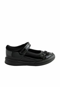 Chaussure Mary Jane en cuir verni noir avec un bout rond, une seule sangle Velcro et un détail en nœud à l'avant. Semelle en caoutchouc texturé.
