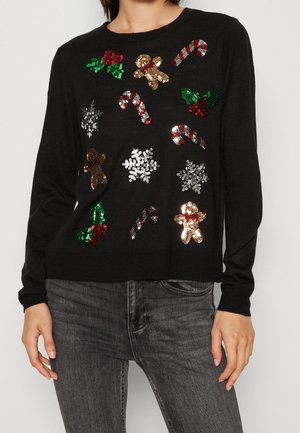 Maglione nero con decorazioni festive in paillettes di bastoncini di zucchero, agrifoglio, fiocchi di neve e figure di pan di zenzero sulla parte anteriore. Maniche lunghe.