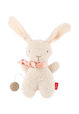 Peluche lapin beige doux avec de longues oreilles, une écharpe fleurie rose et une boîte à musique à tirette fixée sur le côté gauche.