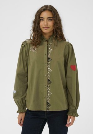 Olive green shirt with a ruffled collar, front button closure, and embroidered floral patterns along the placket and sleeves.