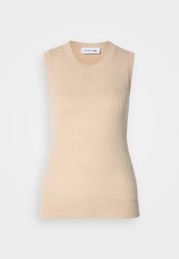 Top de punto sin mangas en color beige con textura acanalada y diseño ajustado. Presenta un cuello redondo y un pequeño logotipo bordado en el pecho.