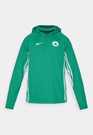 Green Nike hoodie with a half-zip, white side stripes, and a clover logo on the chest. Made from textured, breathable fabric.