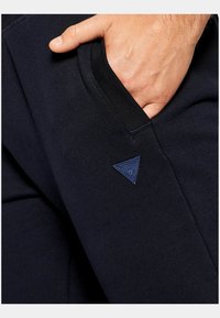 Guess ALDWIN  - Spodnji deli trenirk - azul