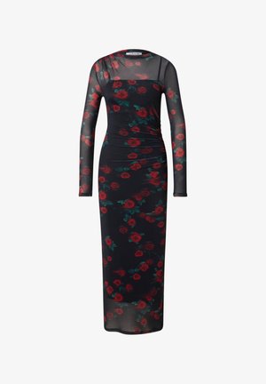 Lang, aansluitend jurkje van doorschijnende stof met een zwarte basis, versierd met rode rozen en groene bladeren, lange mouwen en een geplooide zijkant.