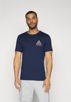Navy blue short-sleeve t-shirt made of soft fabric, featuring a geometric logo in red and orange on the chest and a small logo on the sleeve.