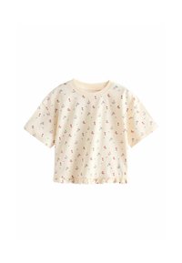 Crop top crème à manches courtes avec petit imprimé floral rouge et bleu et bordure à volants le long de l'ourlet.