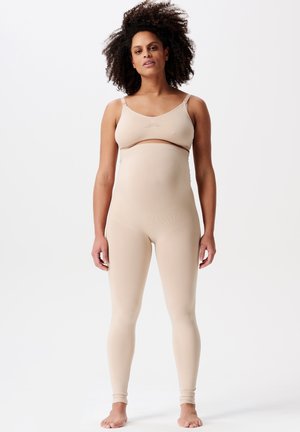 Nahtlose, nackte Umstandsleggings und passendes Crop-Top; dehnbare Stoffe, figurbetontes Design, verstellbare Träger, glatte Textur und keine sichtbaren Nähte.