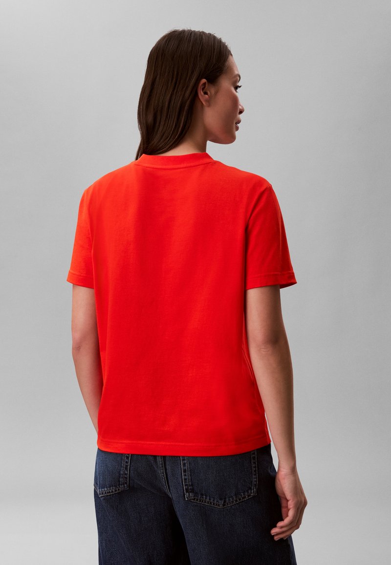 Calvin Klein Jeans HERO CLASSIC MONOLOGO - Triko s potiskem - orange