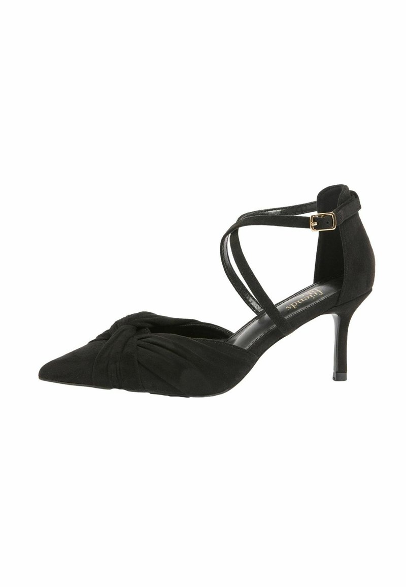 Mustast seemisnahast kõrge kontsaga king, millel on terav nina, esiküljel sõlmedetail ja kriss-krossi stiilis pahkluuääred, mis on kinnitatud kuldse pandlaga.