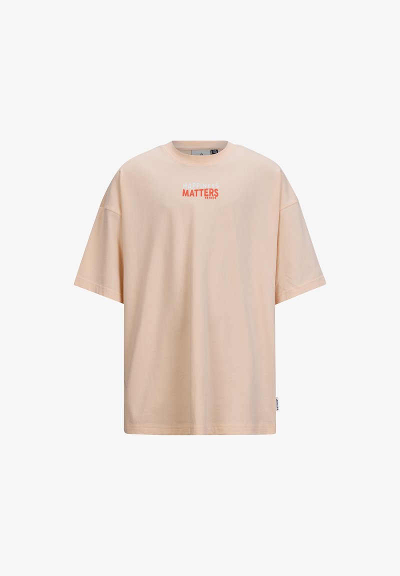 Jasno brzoskwiniowa, oversize'owa koszulka wykonana z miękkiej bawełny. Posiada okrągły dekolt i krótkie rękawy z nadrukiem "SZCZĘŚCIE JEST WAŻNE".