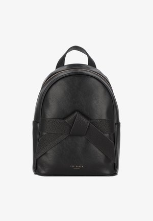 Sac à dos en cuir noir de forme arrondie, avec un détail nœud texturé sur le devant et une fermeture éclair dorée en haut.