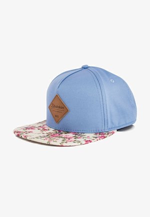 Blue snapback cap with a floral-patterned brim and a brown leather label on the front. Fabric is smooth with structured design.