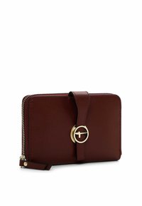 Burgundy leather wallet with gold circular hardware and a flat strap. Features a zip closure and stitched detailing along the edges.