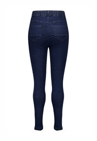 Leggings en denim bleu avec une taille extensible, une silhouette ajustée et deux poches arrière. Texture lisse avec un délavage classique.
