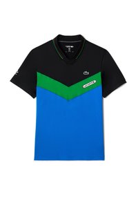 Herrpolo med svart överdel, grön och blå chevrondesign, samt logotypdetalj. Mjukt tyg med krage och sportig skärning.