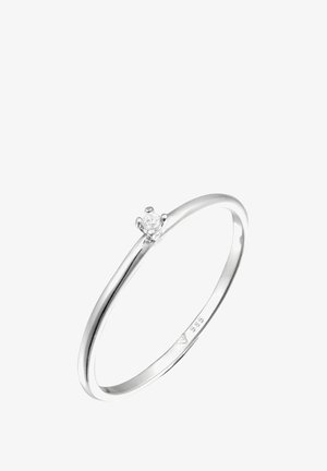 Silberring mit einem glatten, dünnen Band und einem einzelnen runden Diamantmittelstück, das eine polierte Oberfläche und ein minimalistisches Design zeigt.